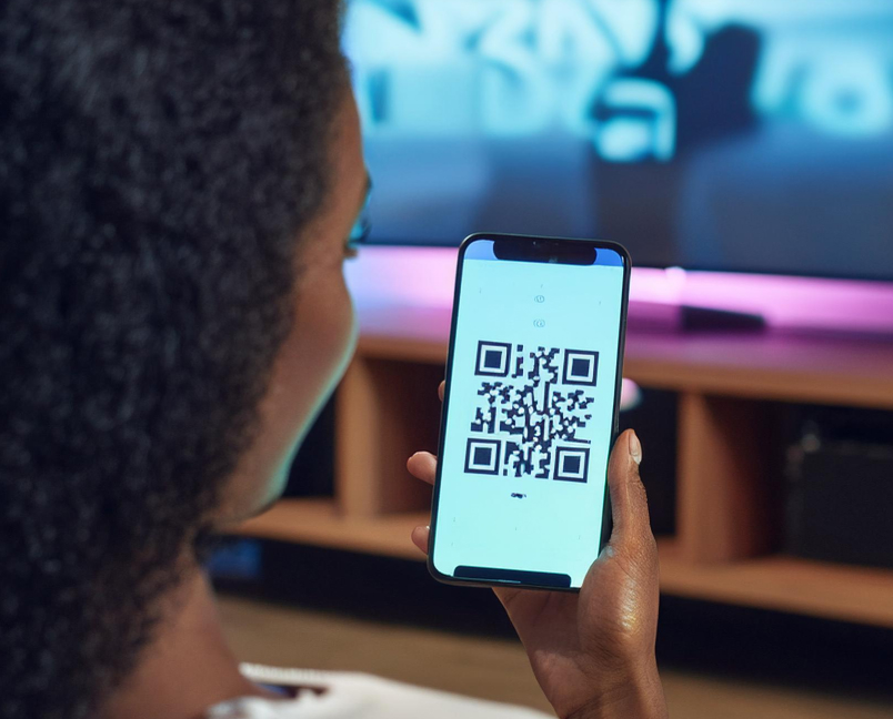 Shopper scanning a connected TV QR code