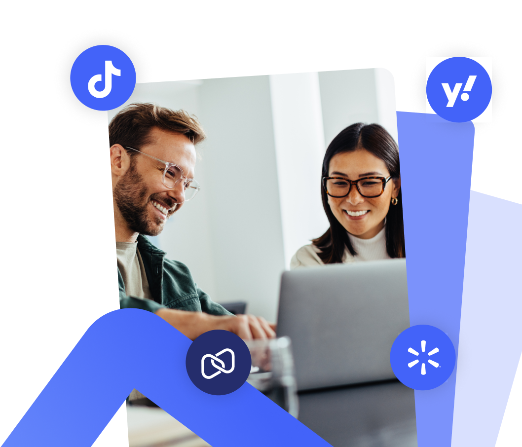 Brand, agency, and platform partners collaborating around a laptop
